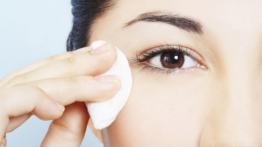 Woman removing makeup