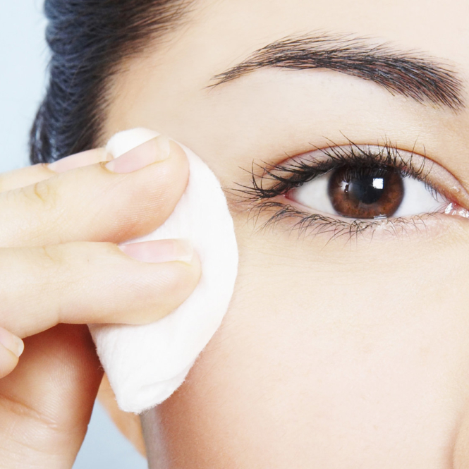 Woman removing makeup